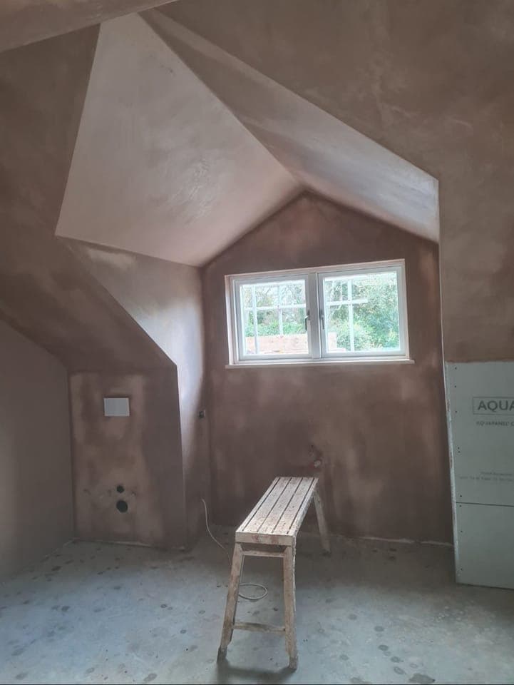 Loft conversion mid plaster, roof window visible